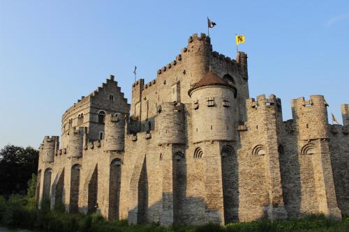 a large castle with turrets on top of it at De Draecke Hostel in Ghent