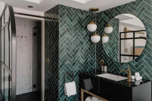 a bathroom with a sink and a mirror at The Halyard Liverpool, Vignette Collection by IHG in Liverpool