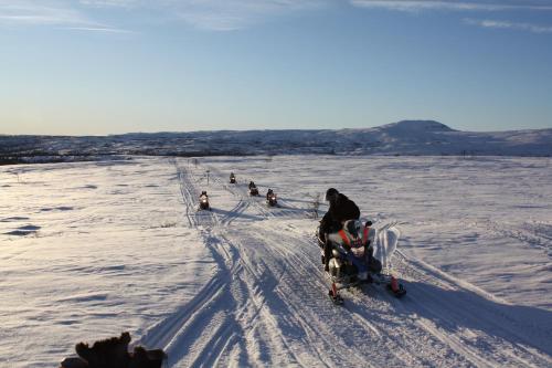 a group of people on skis in the snow at Storliens Fjällgård in Storlien