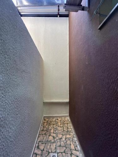 a corner of a room with a wall at Hotel Nova Jerusalém in Goiânia