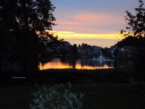 a view of a lake at sunset at Saule in Talsi