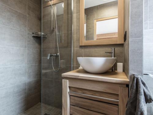 a bathroom with a sink and a shower at Appartement Souplex Chaleureux aux Gets - 4 pers, 2 Ch. en Suite, proche du Centre et des Pistes - FR-1-598-170 in Les Gets