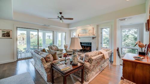 a living room with two couches and a fireplace at PP Villa #6 villa by Peace Vacations in Georgetown