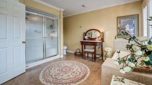 a room with a glass door and a table with a mirror at Mull Cottage home by Peace Vacations in Georgetown