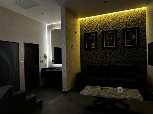 a living room with a couch and a table at MOTEL CIES in Mexicali