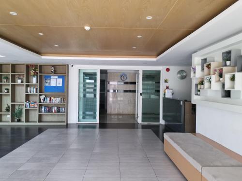 a lobby of a building with a pharmacy at 7 Floor - Mountain view Studio room at OZC near Kata beach in Kata Beach