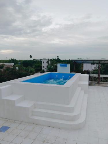 a pool on the roof of a building at Paradise Home Stay Pondicherry Luxury Stay with Private Swimming Pool in Auroville