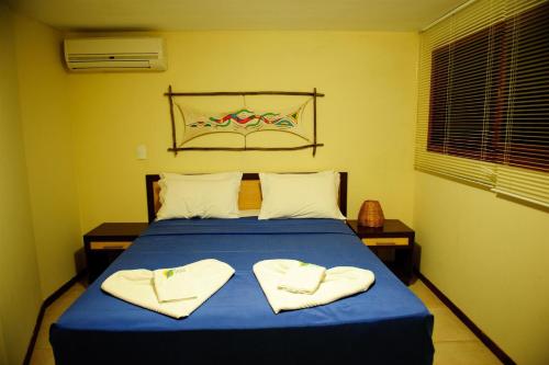 Una cama o camas en una habitación de Solar Pipa Apartments