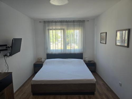 Postel nebo postele na pokoji v ubytování Apartman Cetinje