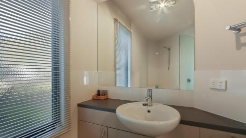a bathroom with a sink and a mirror at Numbawan in Dinner Plain