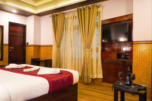Ένα ή περισσότερα κρεβάτια σε δωμάτιο στο Hotel Tarcon