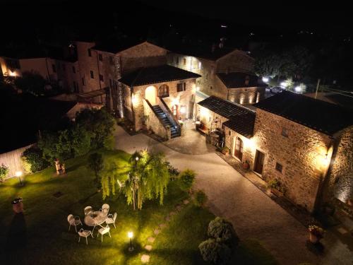 an aerial view of a house at night with lights at Casale l'Antico Carro in Cortona