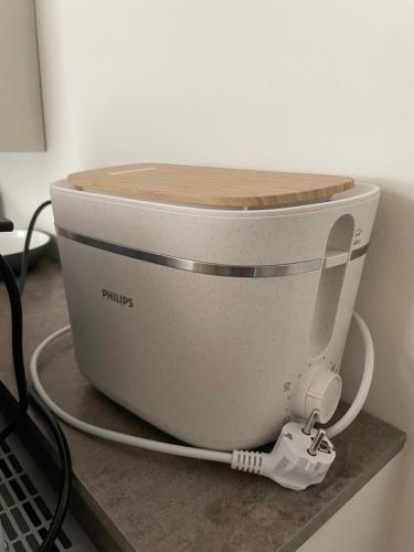 a mixer sitting on a counter with a wooden top at Apartment Hotel Schreier in Lindau