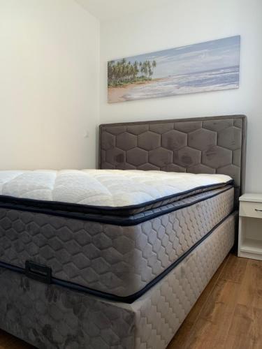 Ένα ή περισσότερα κρεβάτια σε δωμάτιο στο Apartman Royal Lino