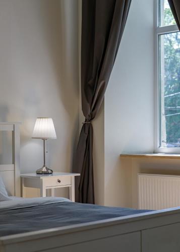 Postel nebo postele na pokoji v ubytování Danylo Inn