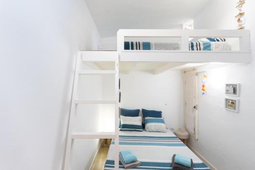 a small room with bunk beds in it at Casita Seafront Oasis del Sur in San Miguel de Abona