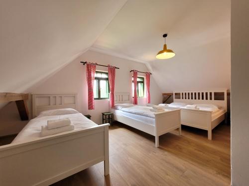 Postel nebo postele na pokoji v ubytování Residence Roubenka Český ráj