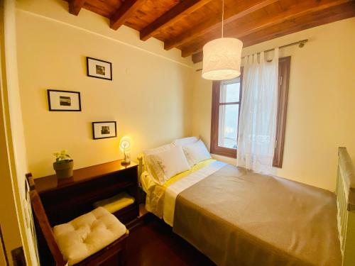 a bedroom with a bed and a window at Wake-up-by-the-sea! in Nydri