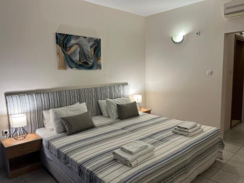 En eller flere senge i et værelse på Persani Hotel
