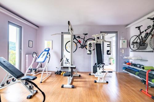 a gym with bikes hanging on the wall at Tenuta Moncarlino in Morsasco
