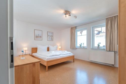 Giường trong phòng chung tại Ferienwohnung Ostseetraum