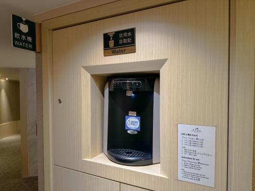 a parking meter in the wall of a bathroom at South Pacific Hotel in Hong Kong