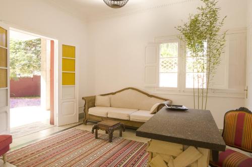 a living room with a couch and a table at Guesthouse Katanka in Las Palmas de Gran Canaria