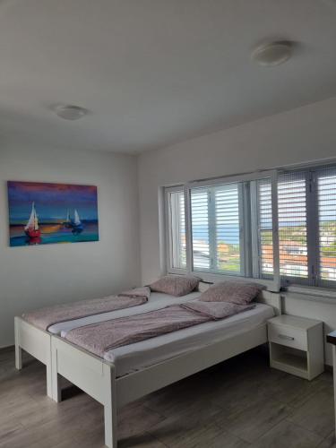 Katil atau katil-katil dalam bilik di Matoc apartments