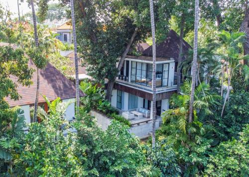 a tree house in the middle of the forest at Martini Suite and Villa in Kerobokan