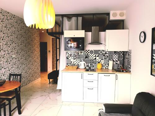Kuchyň nebo kuchyňský kout v ubytování Apartament Ania Stare Miasto