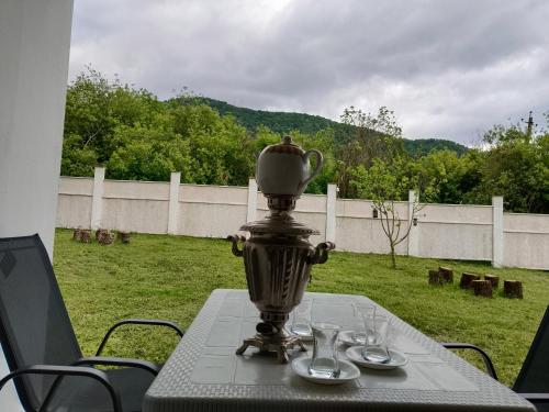 a table with a vase on top of it at Harmony Hideaway 2 in Gabala
