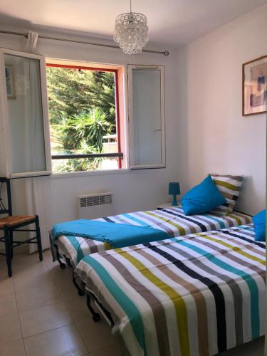 Posteľ alebo postele v izbe v ubytovaní Appartement 60m2 - 2 Chambres à une minute des plages, parking privé