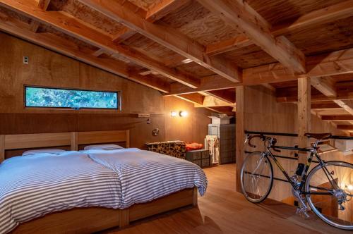Postel nebo postele na pokoji v ubytování Mitake House ー青梅 御岳ハウスー