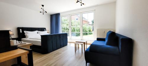 Кровать или кровати в номере KOMM - Terrasse- Parkplatz- Küche- Boxspringbett