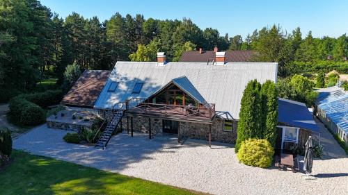 an overhead view of a house with a roof at Aizpuri Park View in Nīca