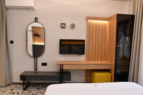 Ένα ή περισσότερα κρεβάτια σε δωμάτιο στο NERO SEASCAPE SUITES