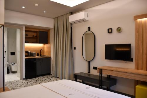 Ένα ή περισσότερα κρεβάτια σε δωμάτιο στο NERO SEASCAPE SUITES