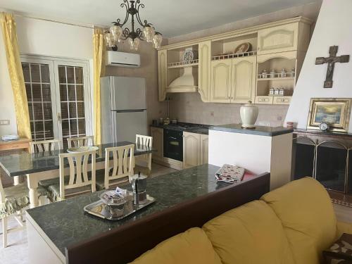 a kitchen with a couch and a counter top at Hssoverato in Soverato Marina