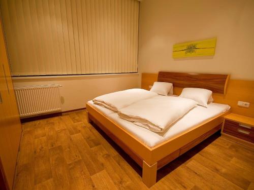 Postel nebo postele na pokoji v ubytování Apartments Obernosterer