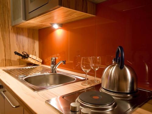 Kuchyň nebo kuchyňský kout v ubytování Apartments Obernosterer