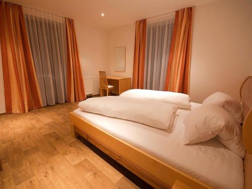 Postel nebo postele na pokoji v ubytování Apartments Obernosterer
