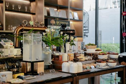 a counter with a bunch of food on it at Richmann Resort Hotel Hatyai in Hat Yai