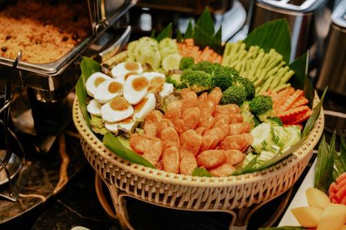 a basket of food with broccoli and other vegetables at Richmann Resort Hotel Hatyai in Hat Yai