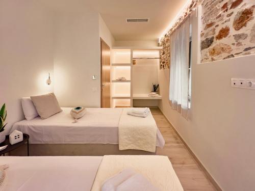 Ένα ή περισσότερα κρεβάτια σε δωμάτιο στο Kefi House Skiathos