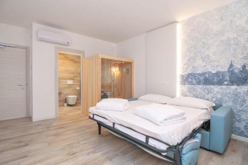 a hospital room with a bed and a bathroom at Marina Palace Hotel 4 stelle S in Caorle