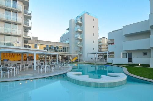 a swimming pool in the middle of a building at Marina Palace Hotel 4 stelle S in Caorle