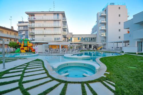a swimming pool in the middle of a building at Marina Palace Hotel 4 stelle S in Caorle