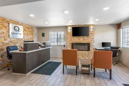 a lobby with a waiting area with chairs and a desk at Quality Inn Show Low in Show Low