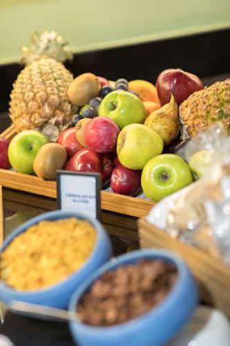 a bunch of different types of fruits on a table at Hilton Mallorca Galatzo in Paguera