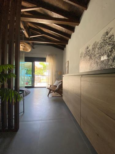 a living room with a large wooden cabinet at Akasti Slow Living in Paralia Sikias